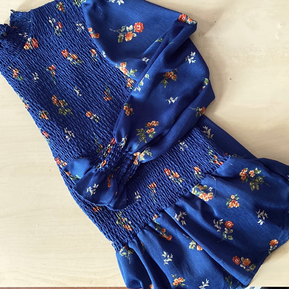 A scrunched blue with flower blouse